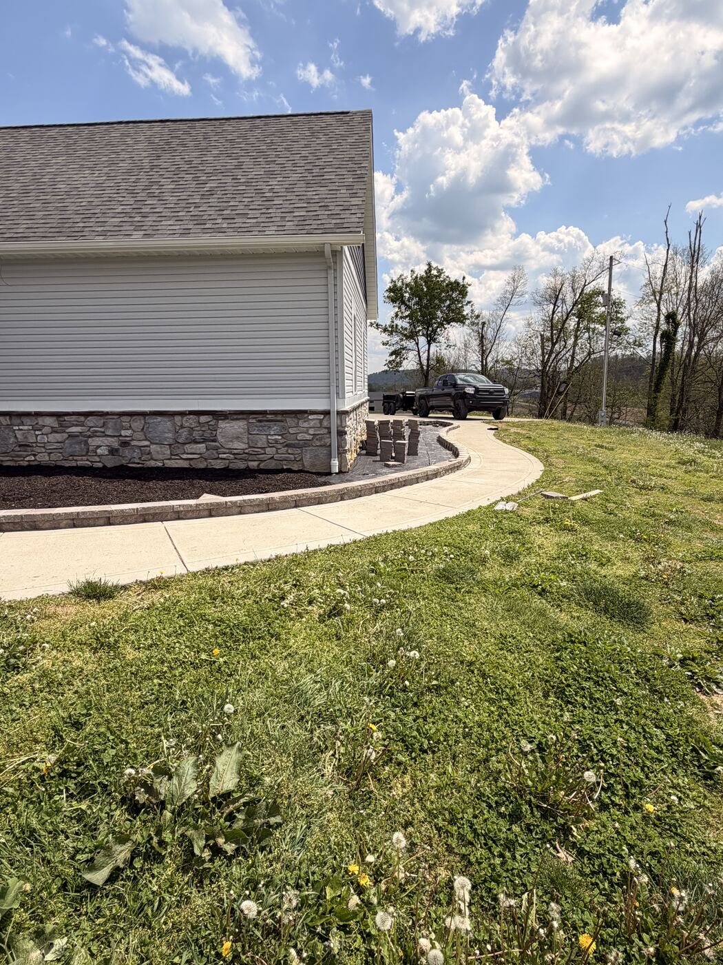 Curved paver walkway with landscape bed edging